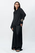 Black draped shirt with flared trouser pants