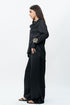 Black draped shirt with flared trouser pants