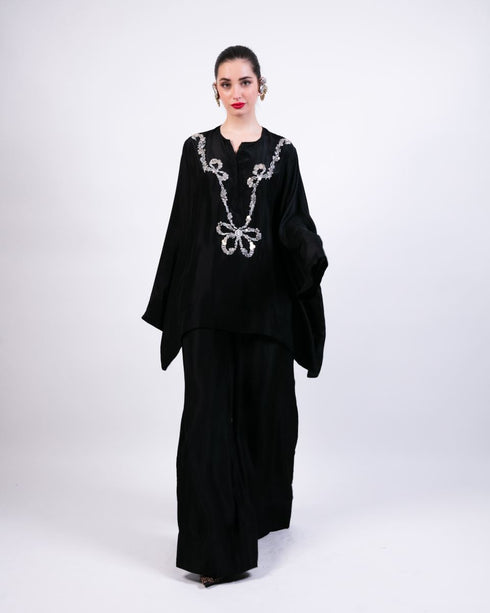 Black short boxy kurta with black flared pants