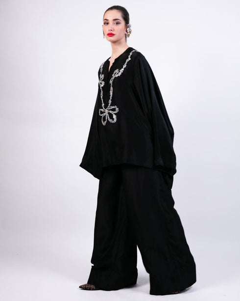 Black short boxy kurta with black flared pants