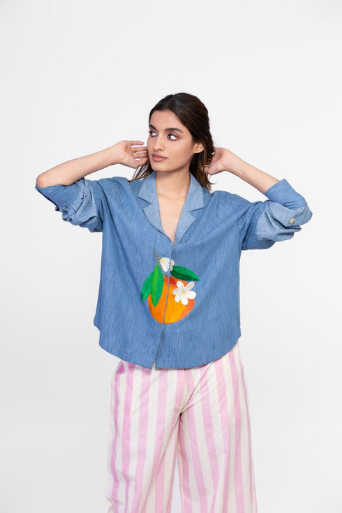 Soft denim top with embroidered patch