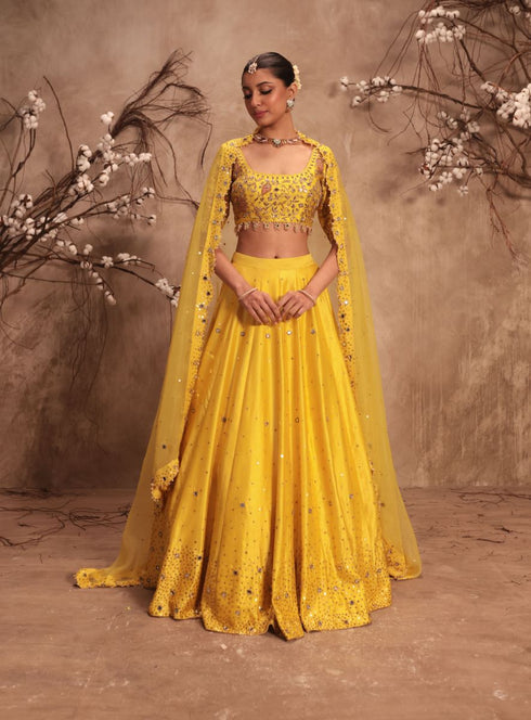 Nazakat yellow heavy mirror work lehenga set