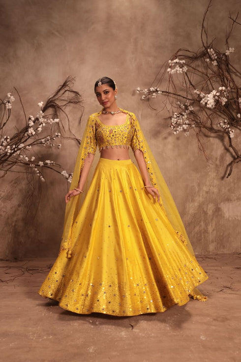 Nazakat yellow heavy mirror work lehenga set