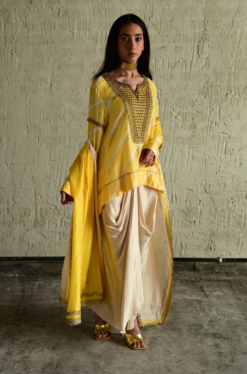 Shabana yellow leheriya top with ivory cowl skirt