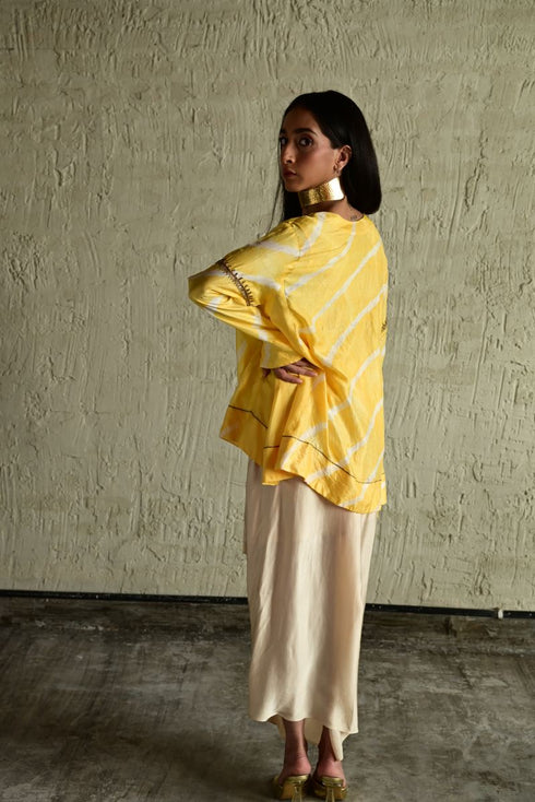Shabana yellow leheriya top with ivory cowl skirt