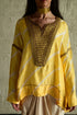Shabana yellow leheriya top with ivory cowl skirt