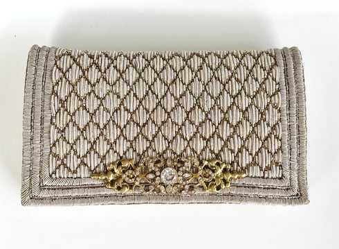 The pique silver clutch