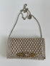 The pique silver clutch