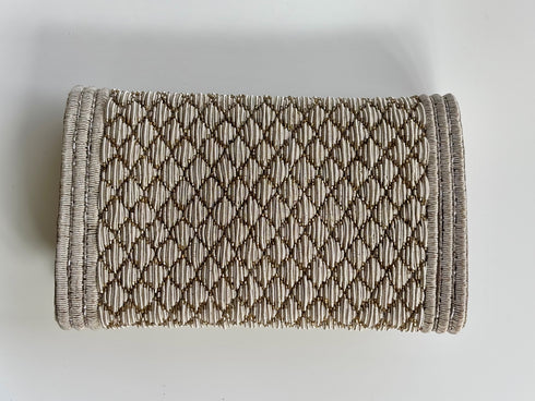 The pique silver clutch