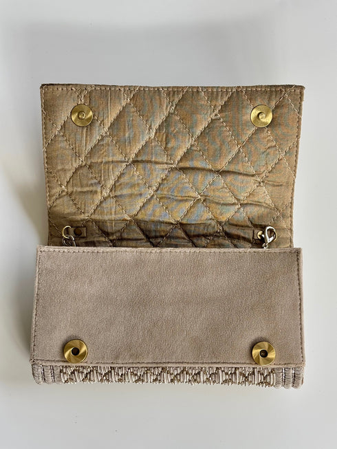 The pique silver clutch