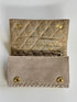 The pique silver clutch