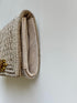 The pique silver clutch