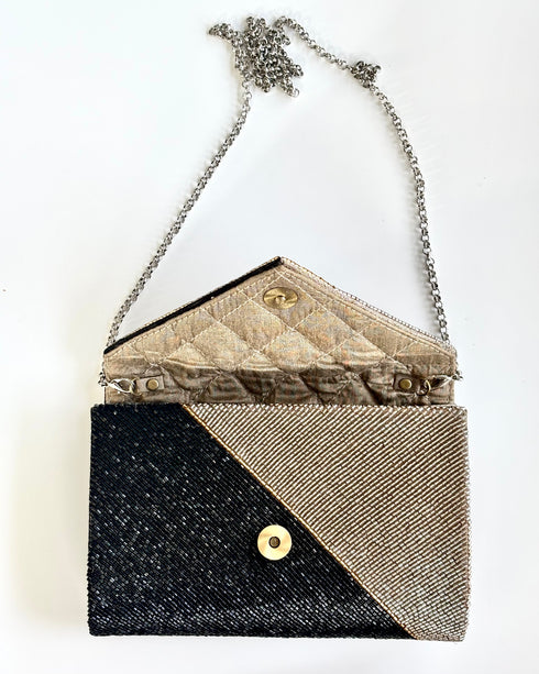 The saarinen black and silver clutch