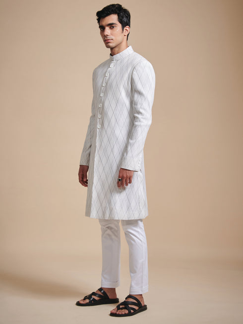 The tuck and stitch off white achkan