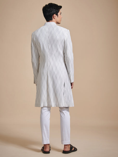 The tuck and stitch off white achkan