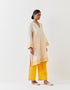 Varna champagne and mango yellow hand embroidered tunic with trousers