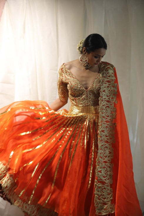 Aikeyah bright orange double layered lehenga set