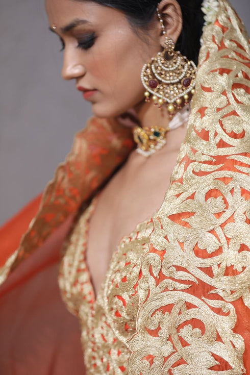 Aikeyah bright orange double layered lehenga set