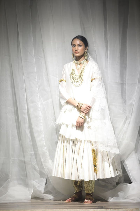Aikeyah off white layered top paired with skirt, gota salwar and dupatta