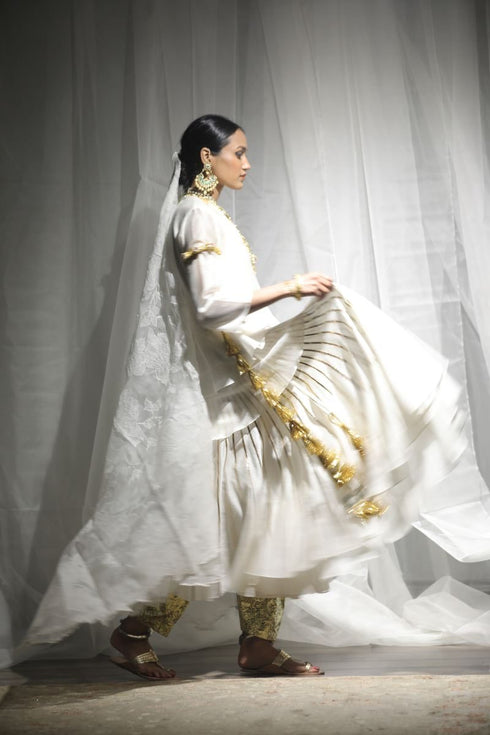 Aikeyah off white layered top paired with skirt, gota salwar and dupatta