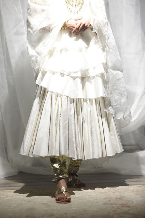 Aikeyah off white layered top paired with skirt, gota salwar and dupatta